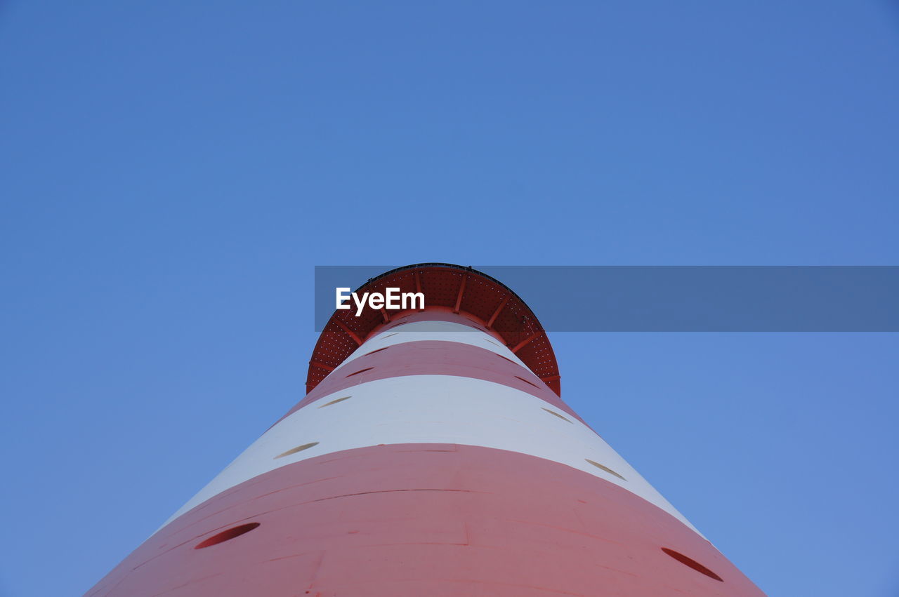 LOW ANGLE VIEW OF SMOKE STACKS AGAINST CLEAR BLUE SKY