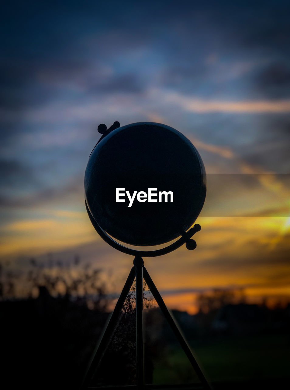 CLOSE-UP OF SILHOUETTE METALLIC STRUCTURE AGAINST SKY AT SUNSET