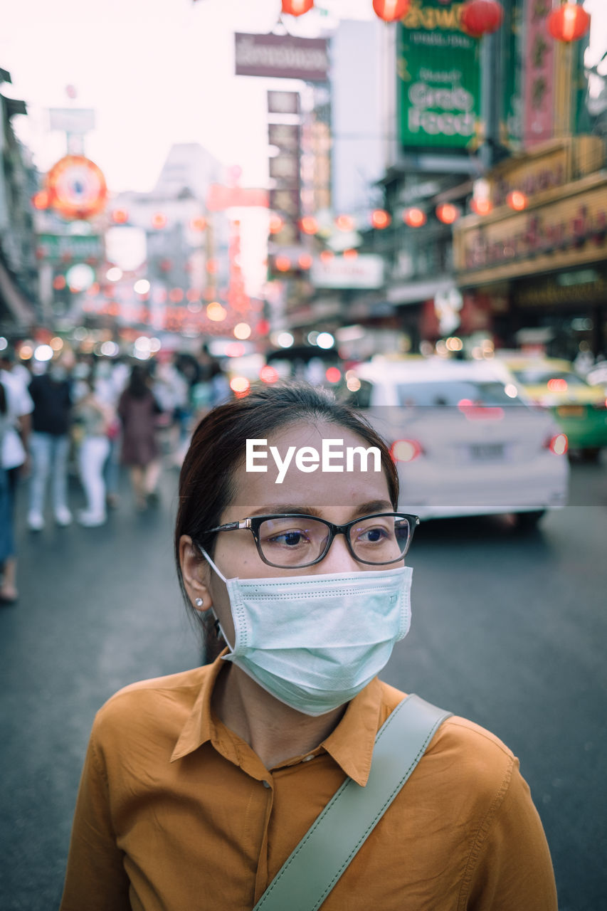 Portrait of beautiful woman on street in city