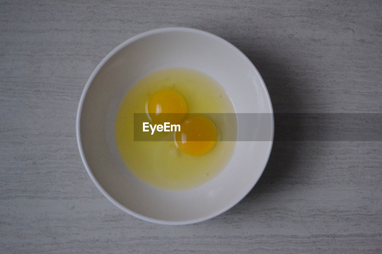 Directly above shot of eggs in bowl on table