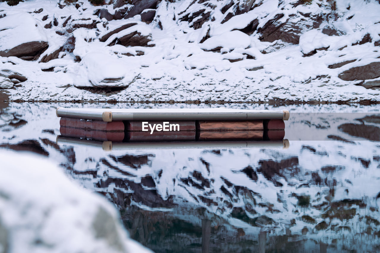 snow, winter, cold temperature, water, nature, no people, day, mountain, scenics - nature, environment, beauty in nature, freezing, outdoors, architecture, frozen, built structure, wood, landscape, ice, tranquility