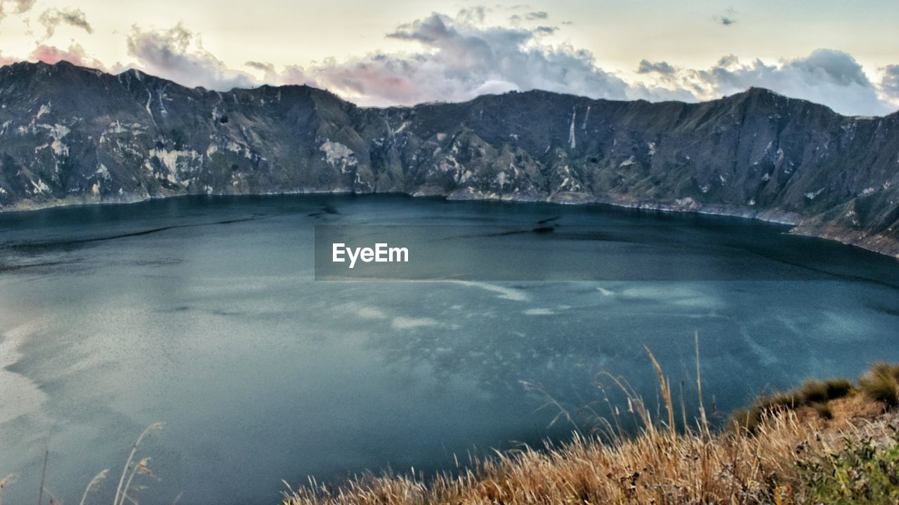 SCENIC VIEW OF LAKE AGAINST SKY DURING WINTER