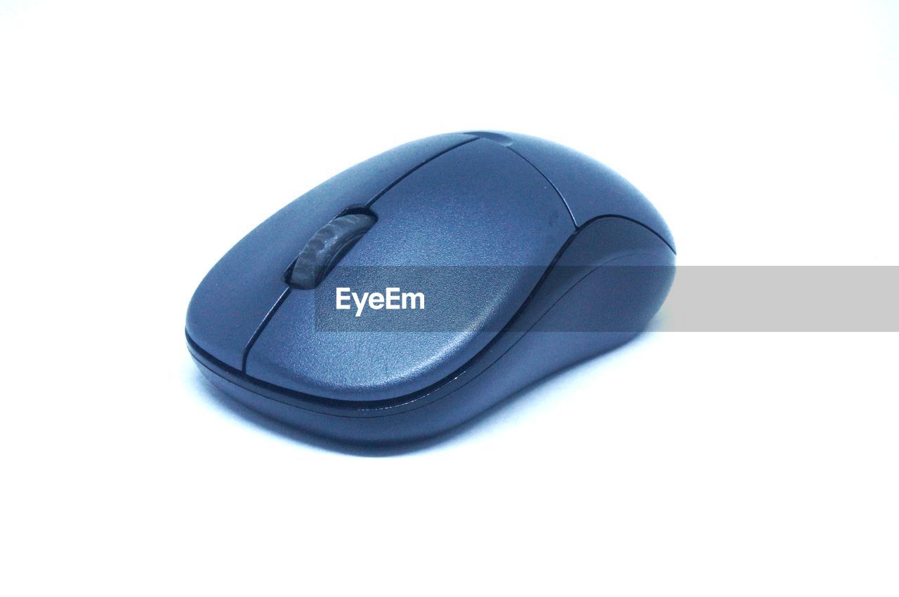Close-up of computer mouse over white background