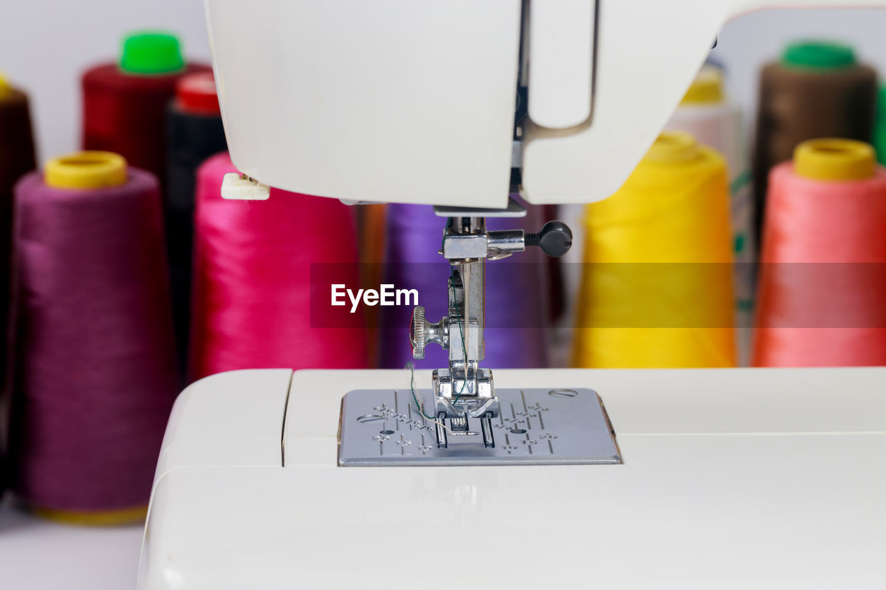 close-up of sewing machine on table