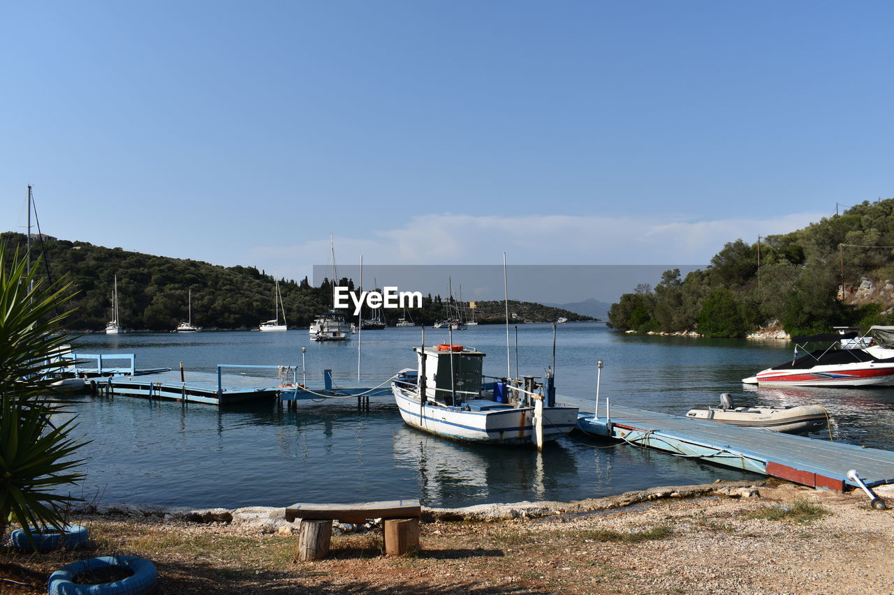 Boats moored at harbor