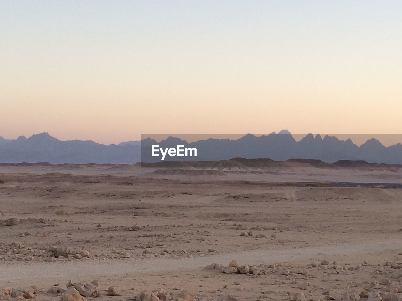 SCENIC VIEW OF MOUNTAINS AGAINST CLEAR SKY