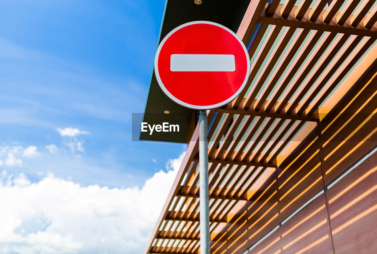 Road sign travel prohibited on a background of blue sky