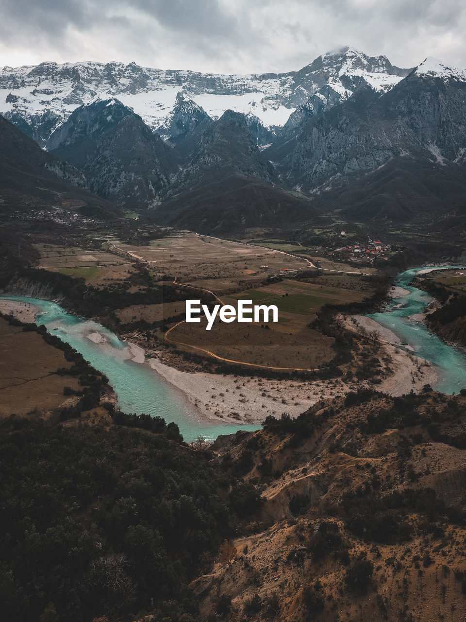 High angle view of snowcapped mountains against sky