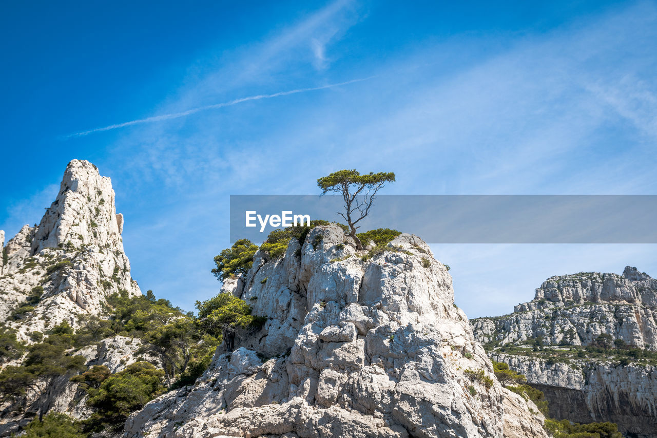 Low angle view of rock formation against sky