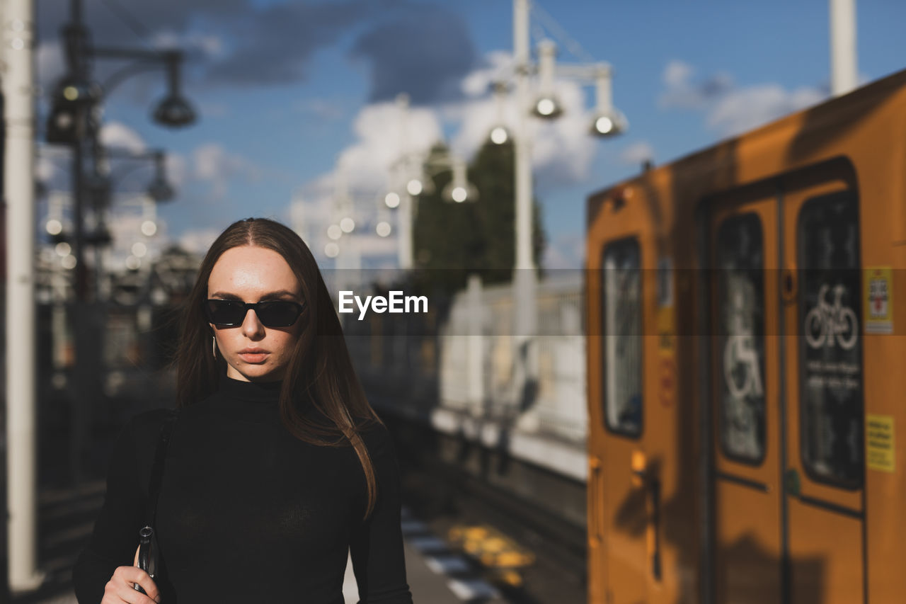 Portrait of young woman in sunglasses