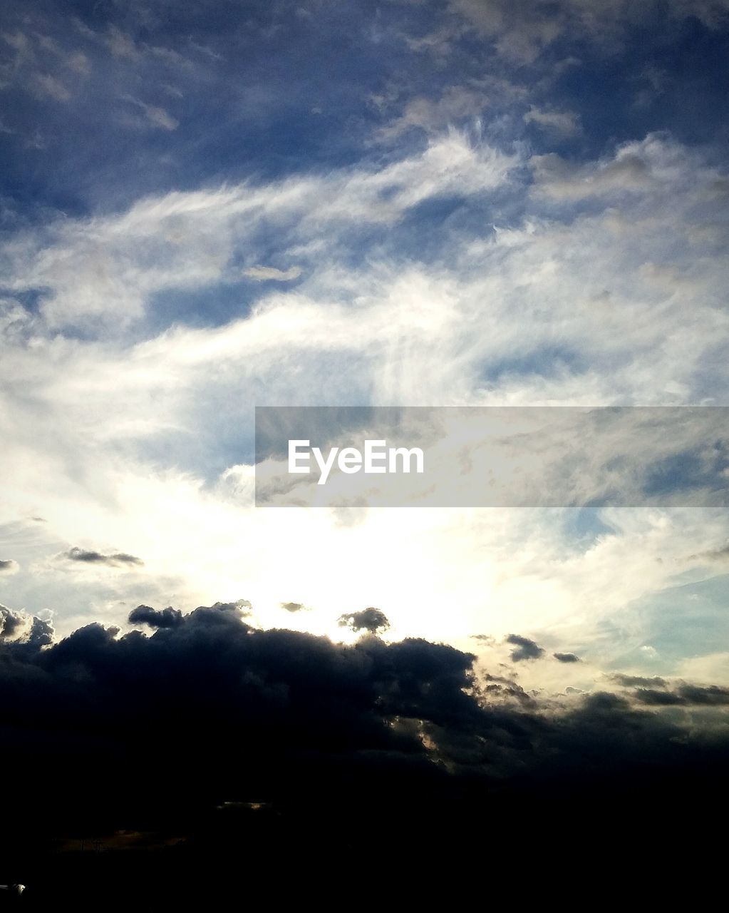 SCENIC VIEW OF MOUNTAINS AGAINST CLOUDY SKY