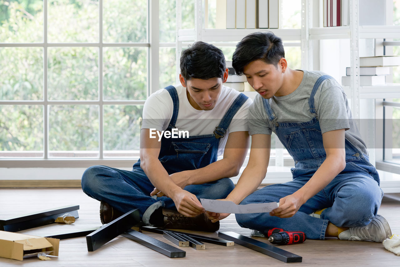 Carpenters brainstorming at construction site