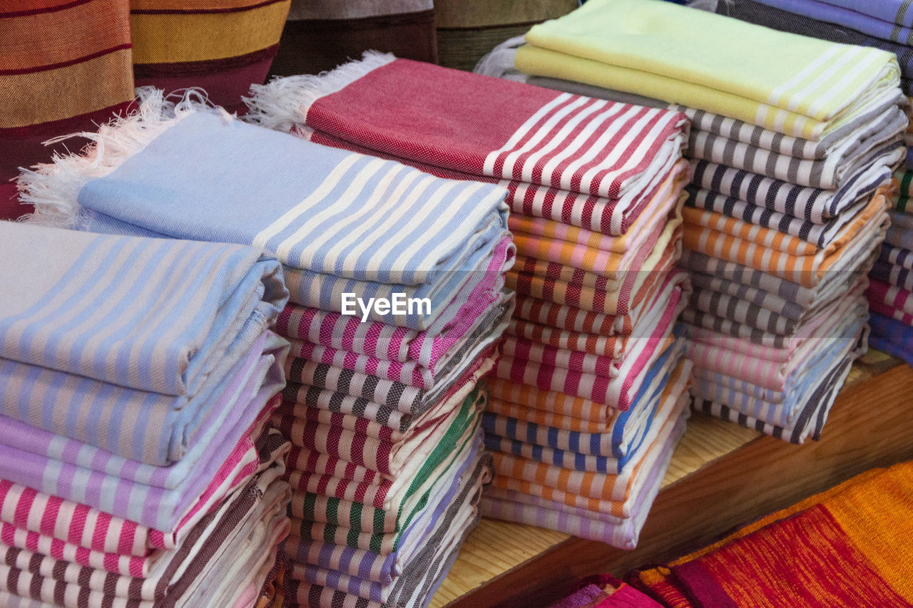 HIGH ANGLE VIEW OF MULTI COLORED CAKE ON TABLE