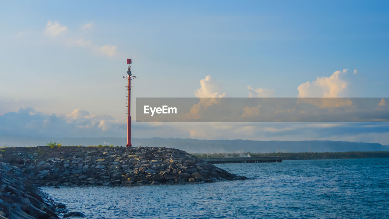SEA BY BUILDING AGAINST SKY