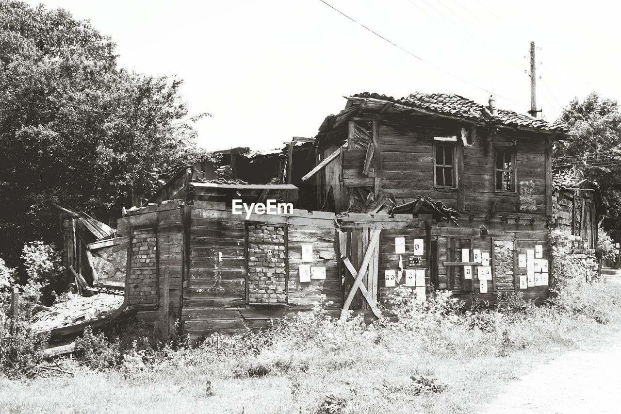 HOUSE AGAINST TREES