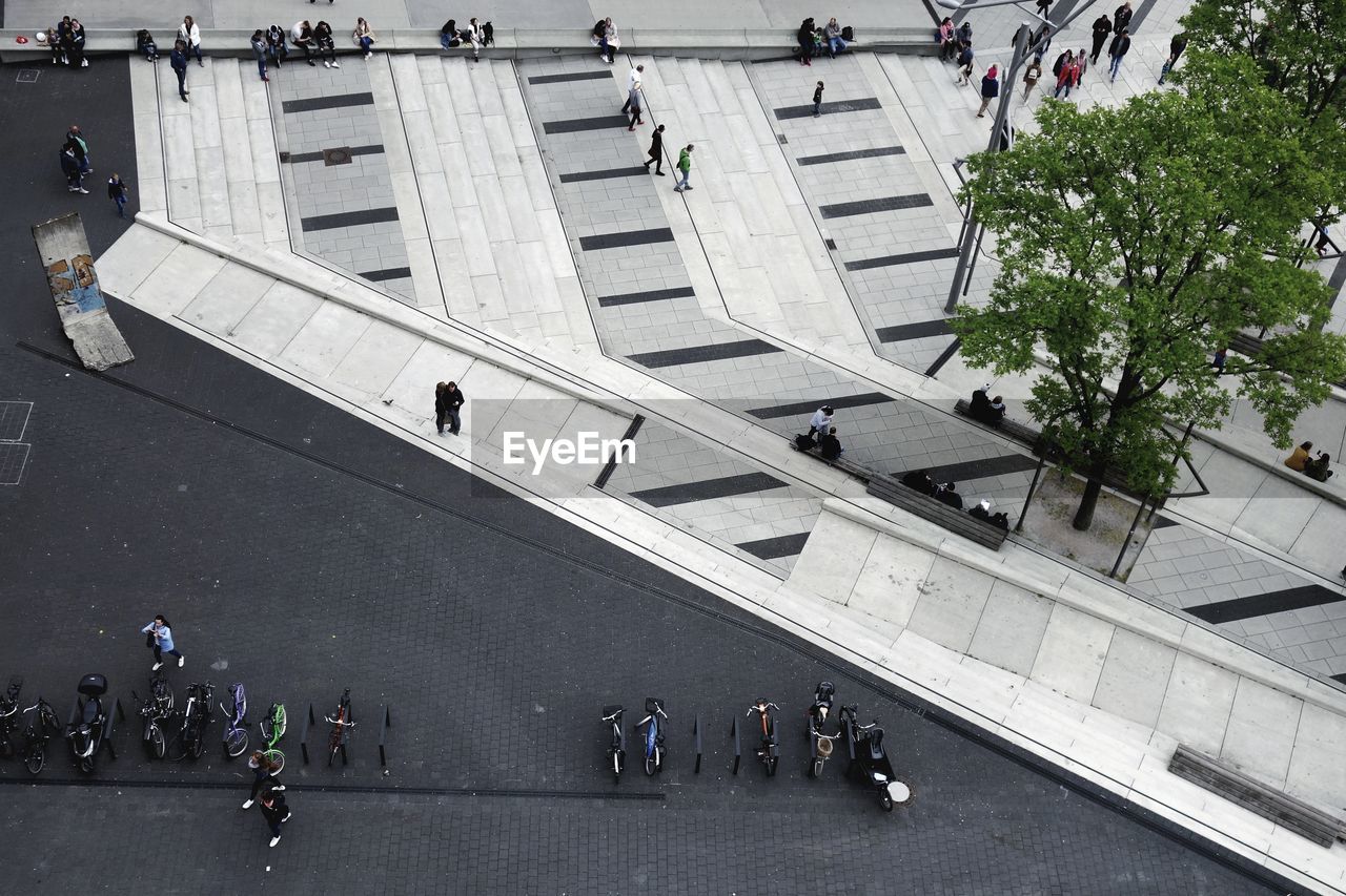 Aerial view of people on road in city