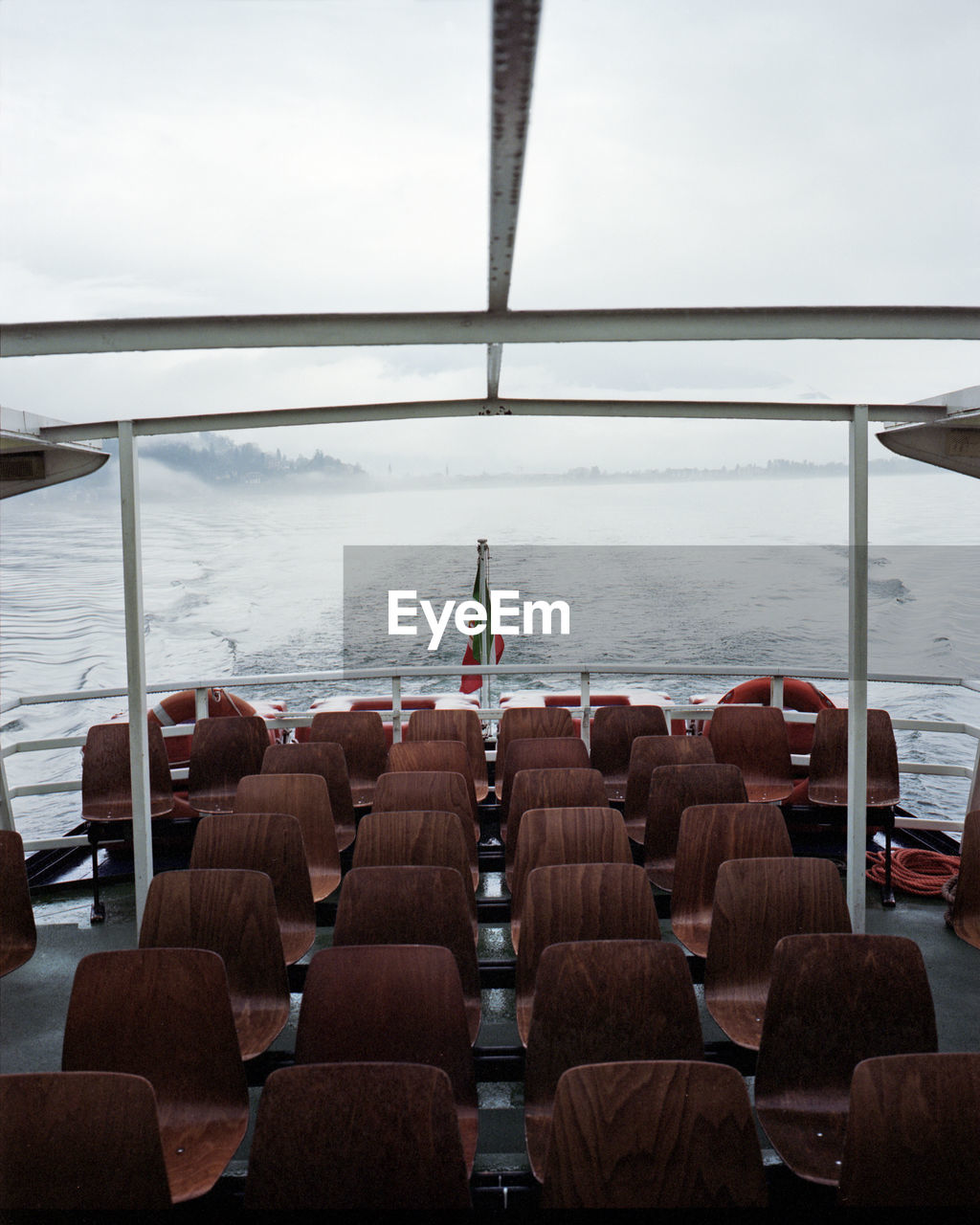 High angle view of empty seats in ferry boat sailing on sea