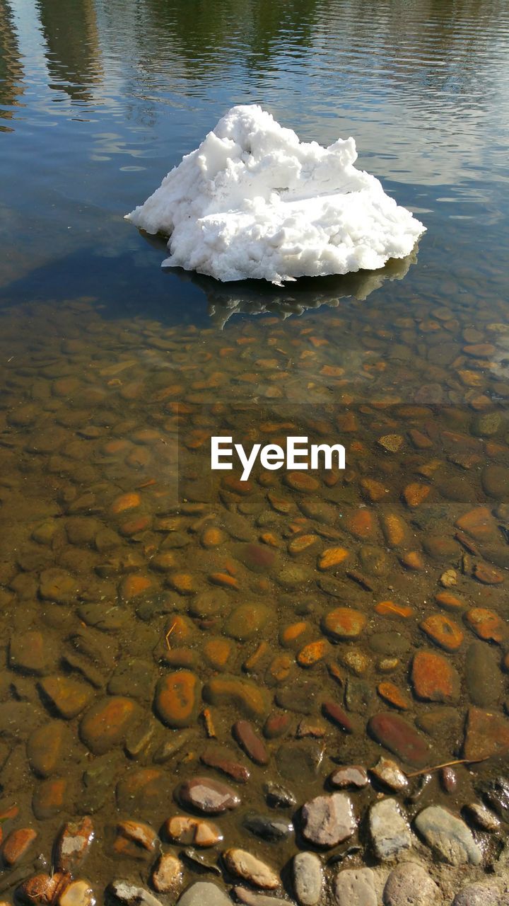 High angle view of ice floating on sea