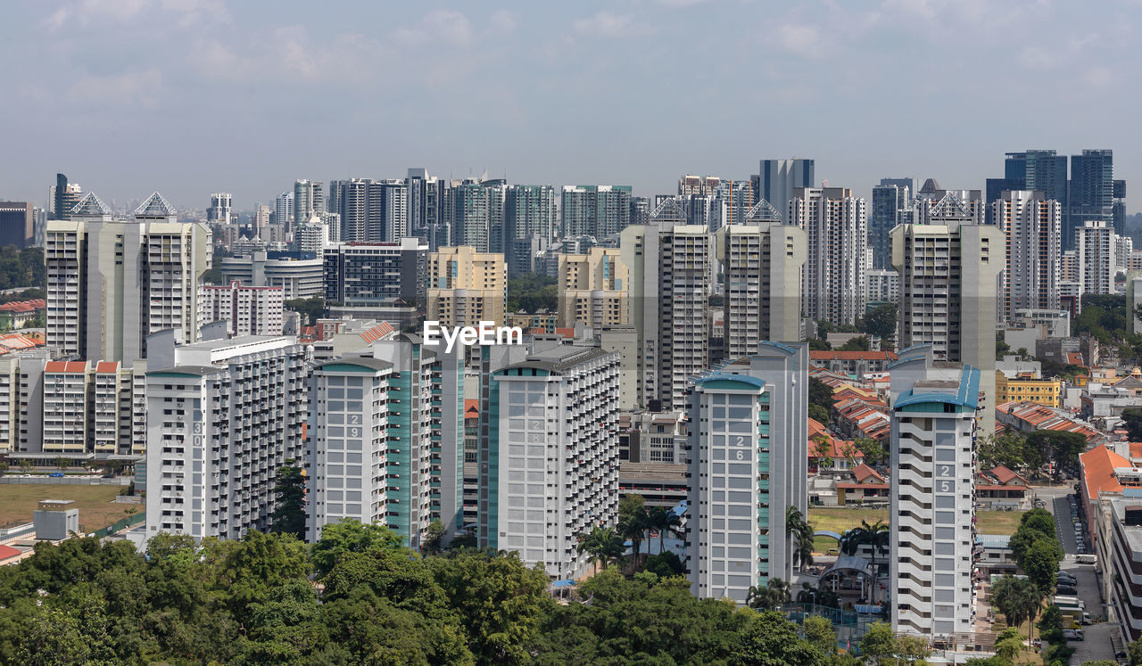 High angle view of modern buildings in city against sky