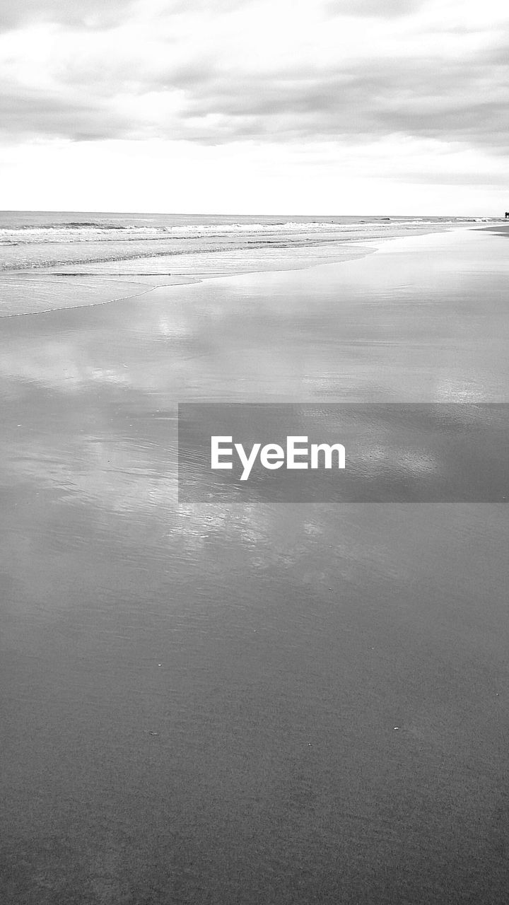 Scenic view of calm sea against sky