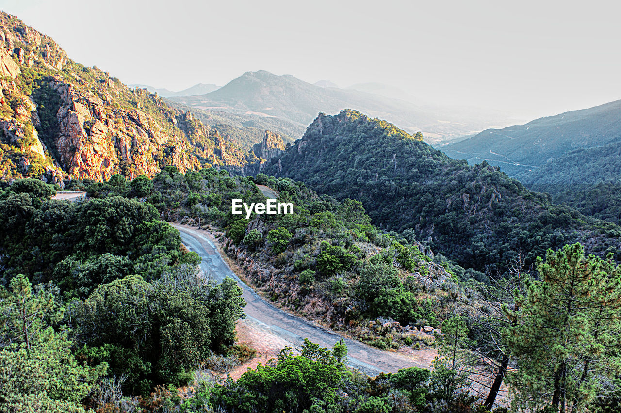 SCENIC VIEW OF LANDSCAPE AND MOUNTAINS AGAINST SKY