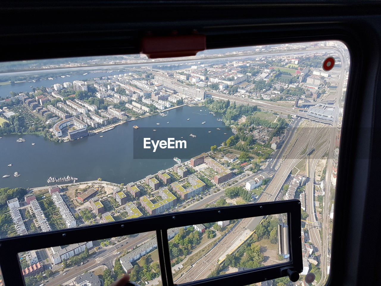 AERIAL VIEW OF CITYSCAPE THROUGH WINDOW