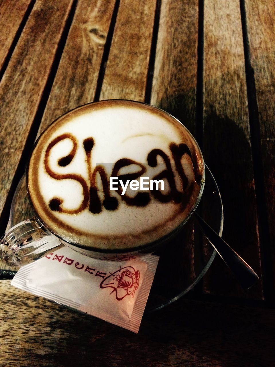 CLOSE-UP OF COFFEE CUP ON TABLE