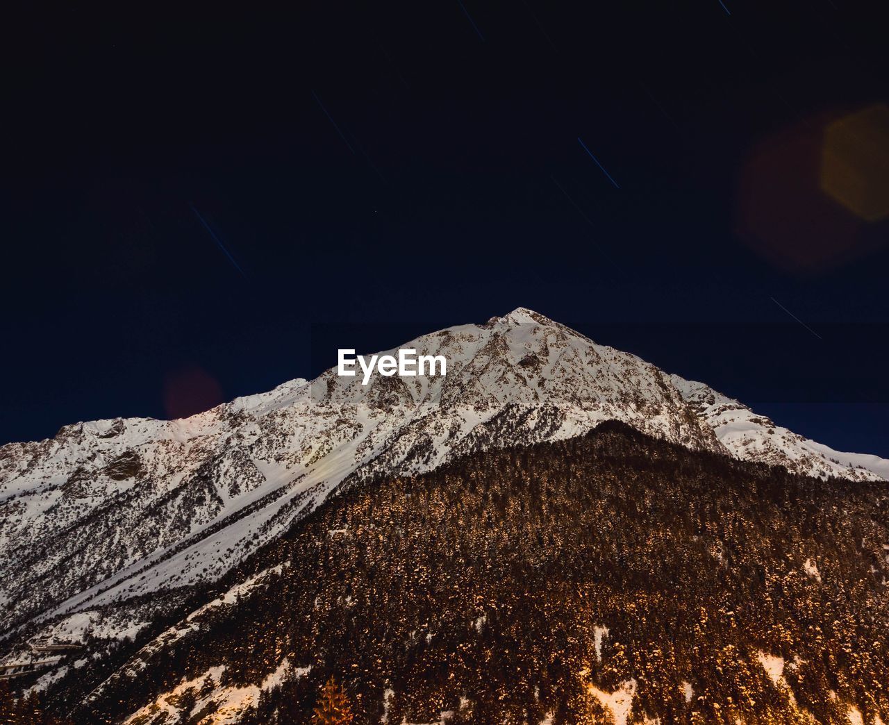 LOW ANGLE VIEW OF SNOW COVERED MOUNTAIN AGAINST CLEAR SKY