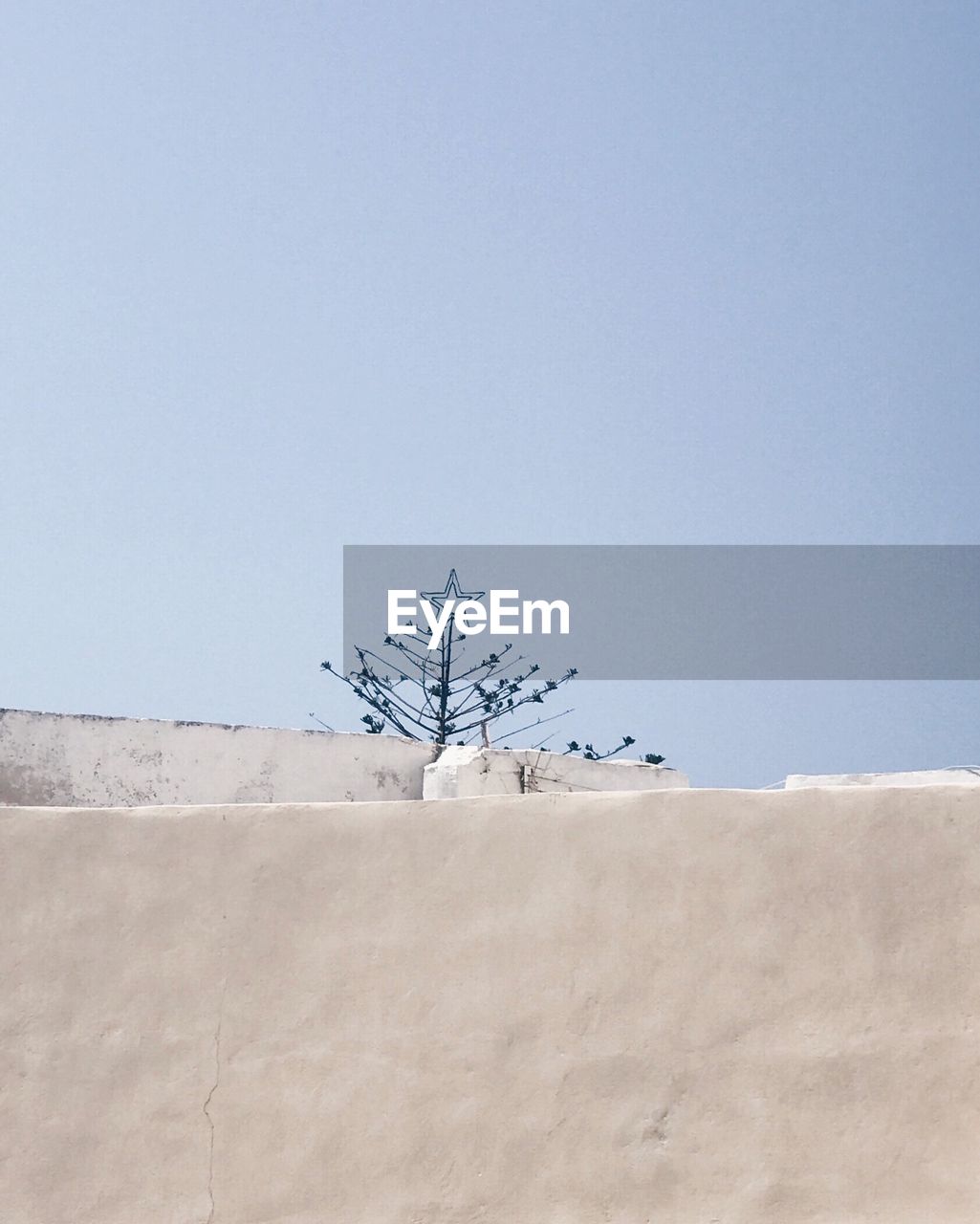 Low angle view of wall against clear sky