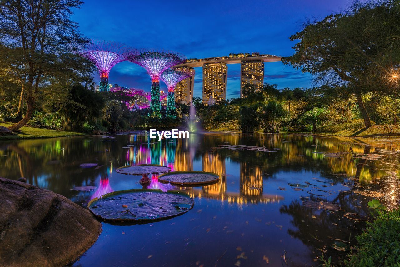 Illuminated gazebo in park against sky at night