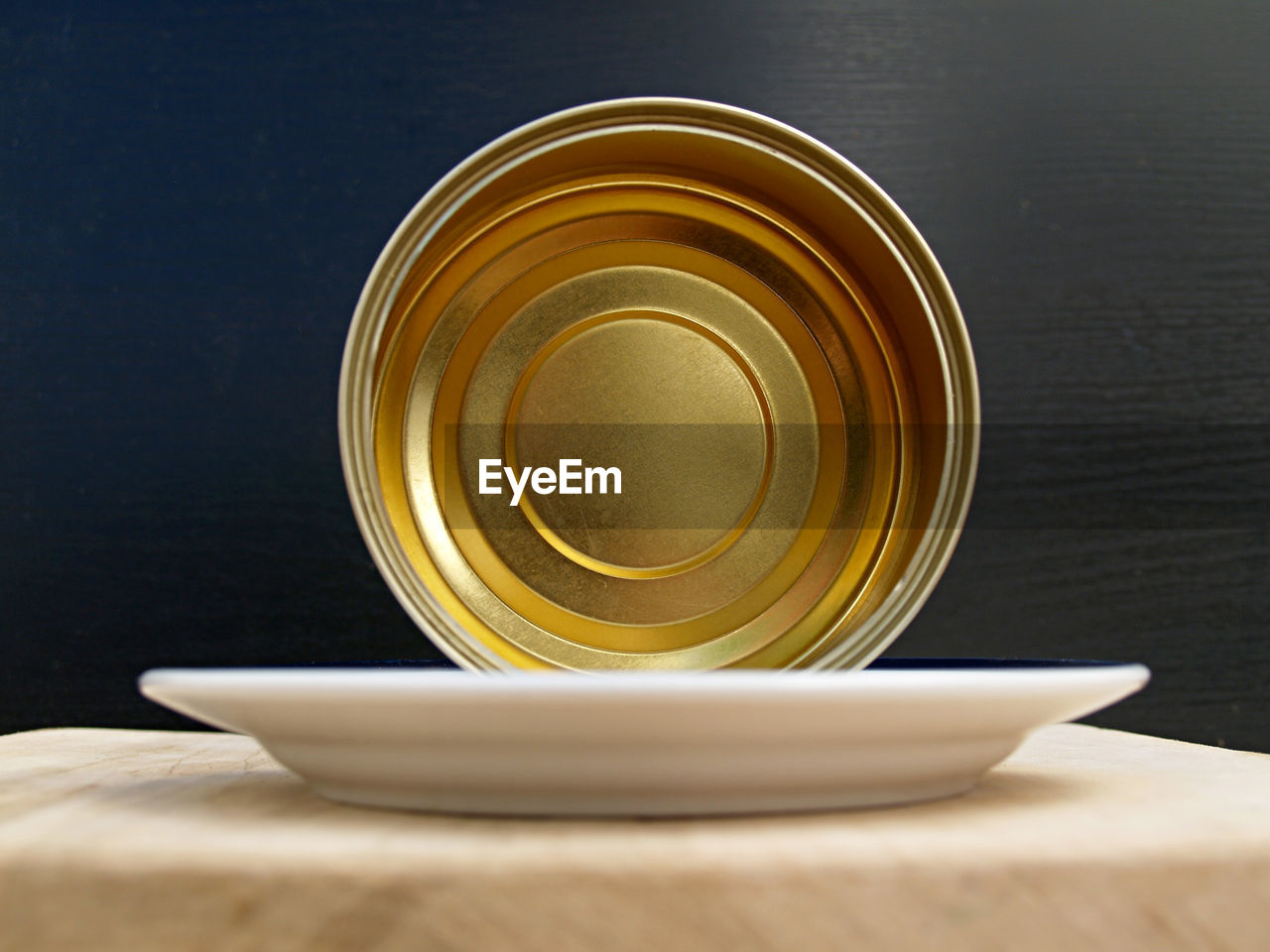 food and drink, cup, yellow, table, indoors, drink, no people, wood, close-up, crockery, studio shot, still life, saucer, mug, food, refreshment, gold, coffee cup, lighting