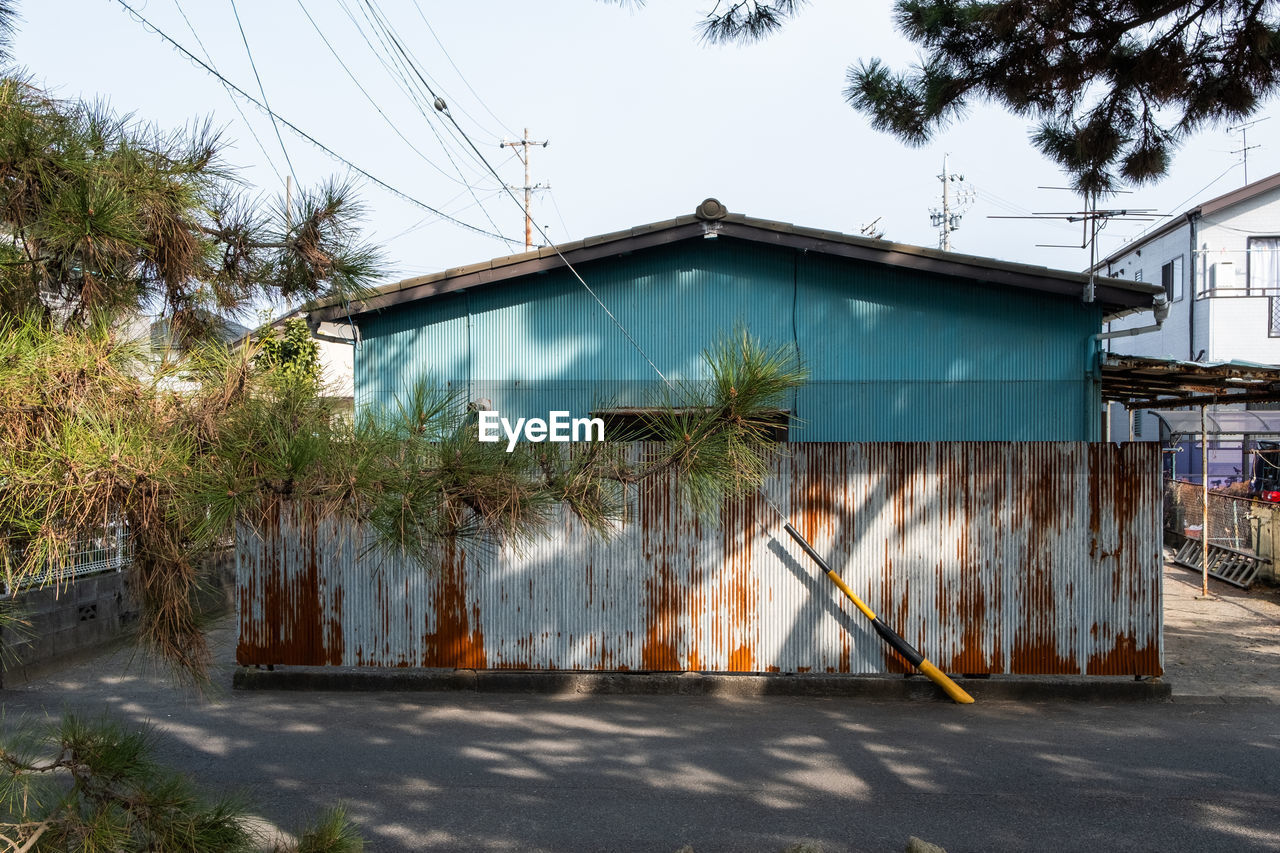 Exterior of abandoned building against clear sky