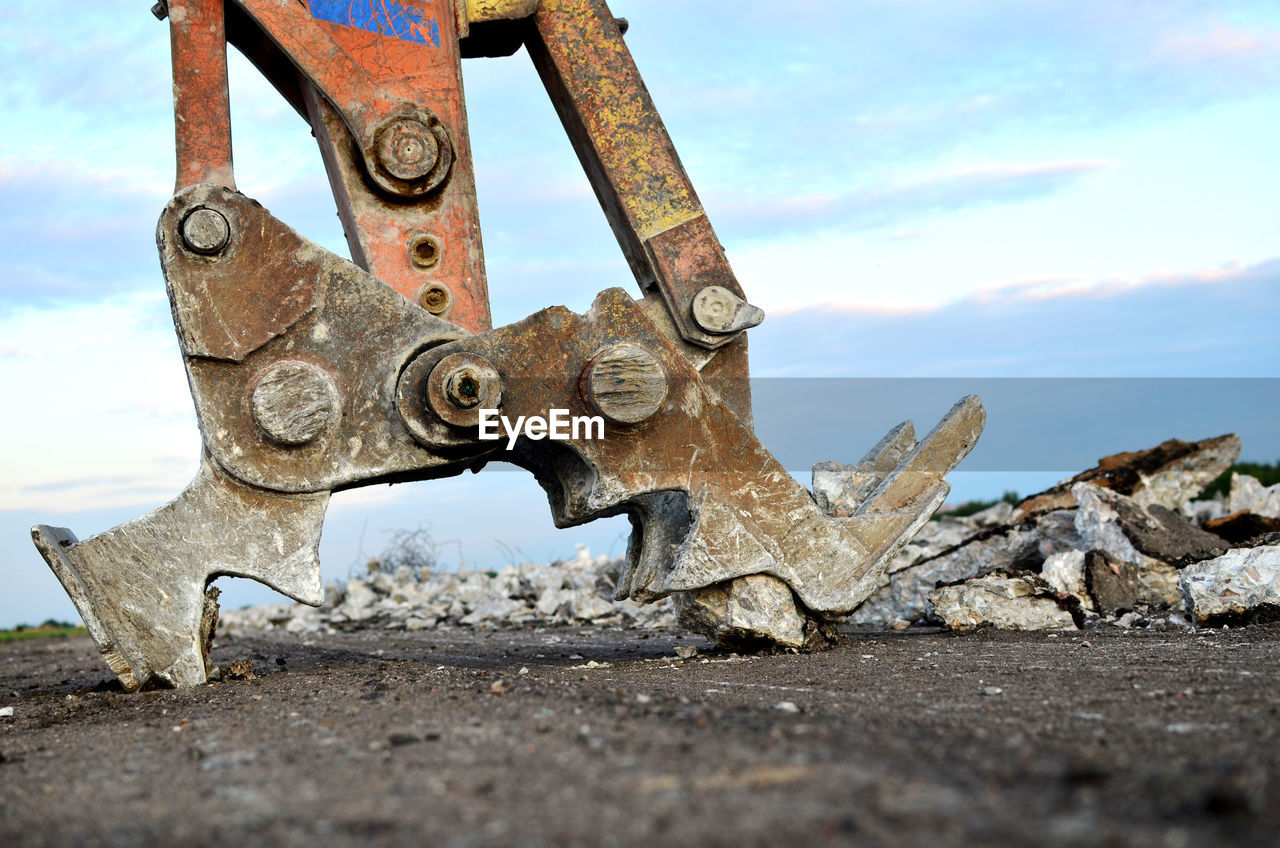 CLOSE-UP OF RUSTY MACHINE PART