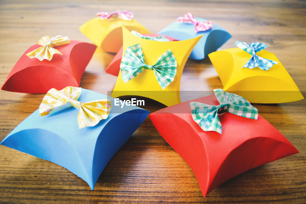 Close-up of colorful gift boxes on wooden table