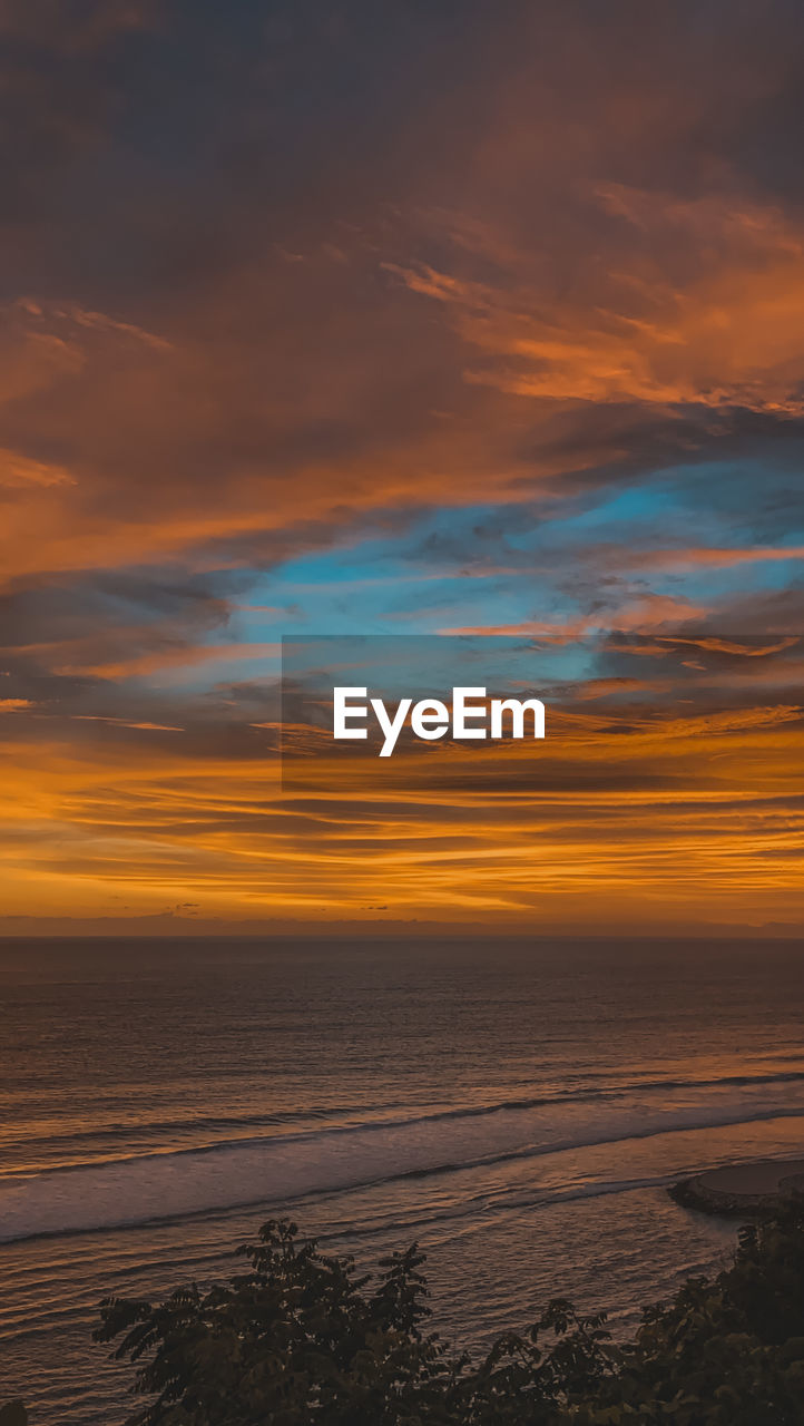 SCENIC VIEW OF SEA AGAINST ROMANTIC SKY