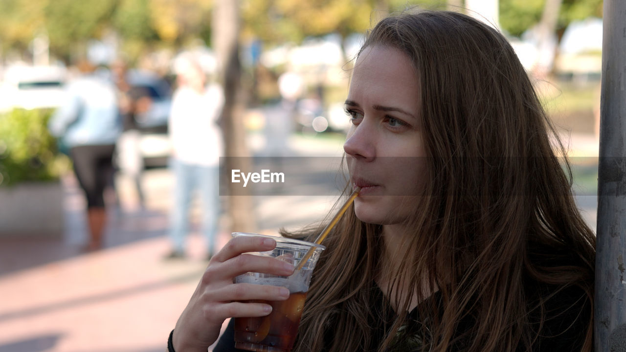 close-up of young woman using phone