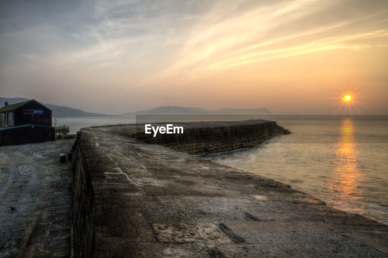 Scenic view of sea against sky at sunset