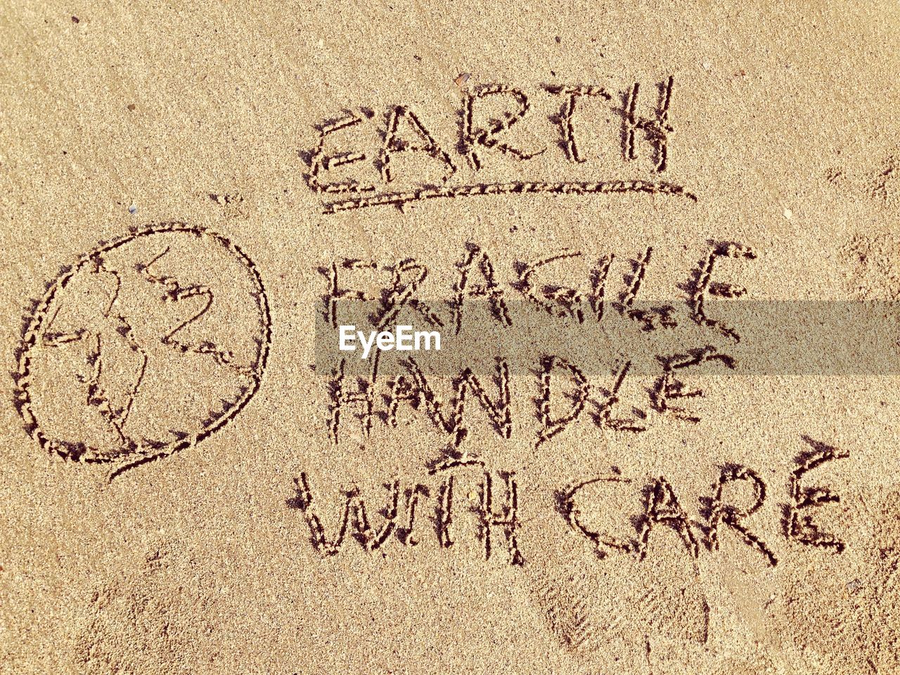 High angle view of text on sand at beach