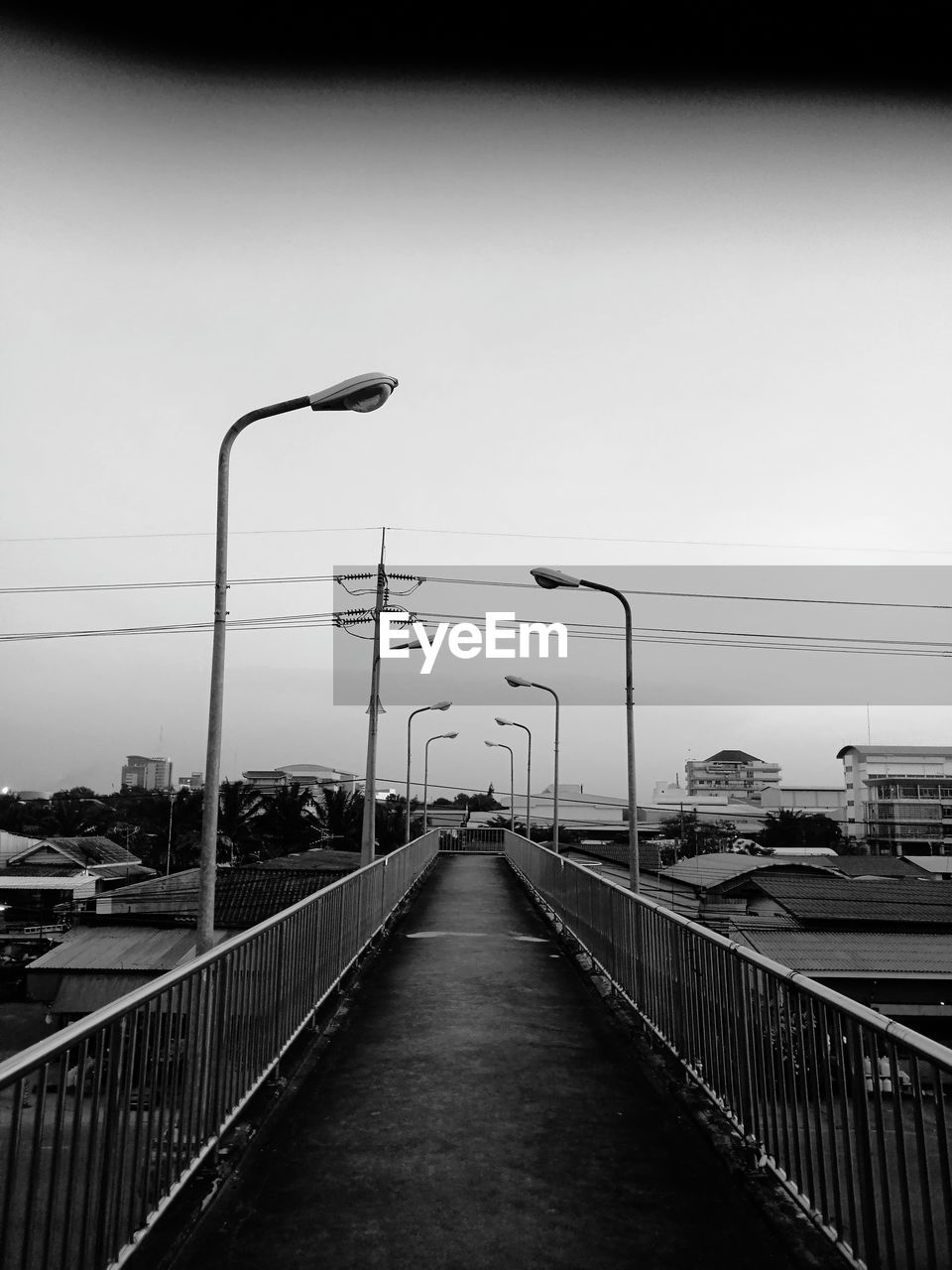 STREET LIGHTS ON BRIDGE AGAINST CLEAR SKY