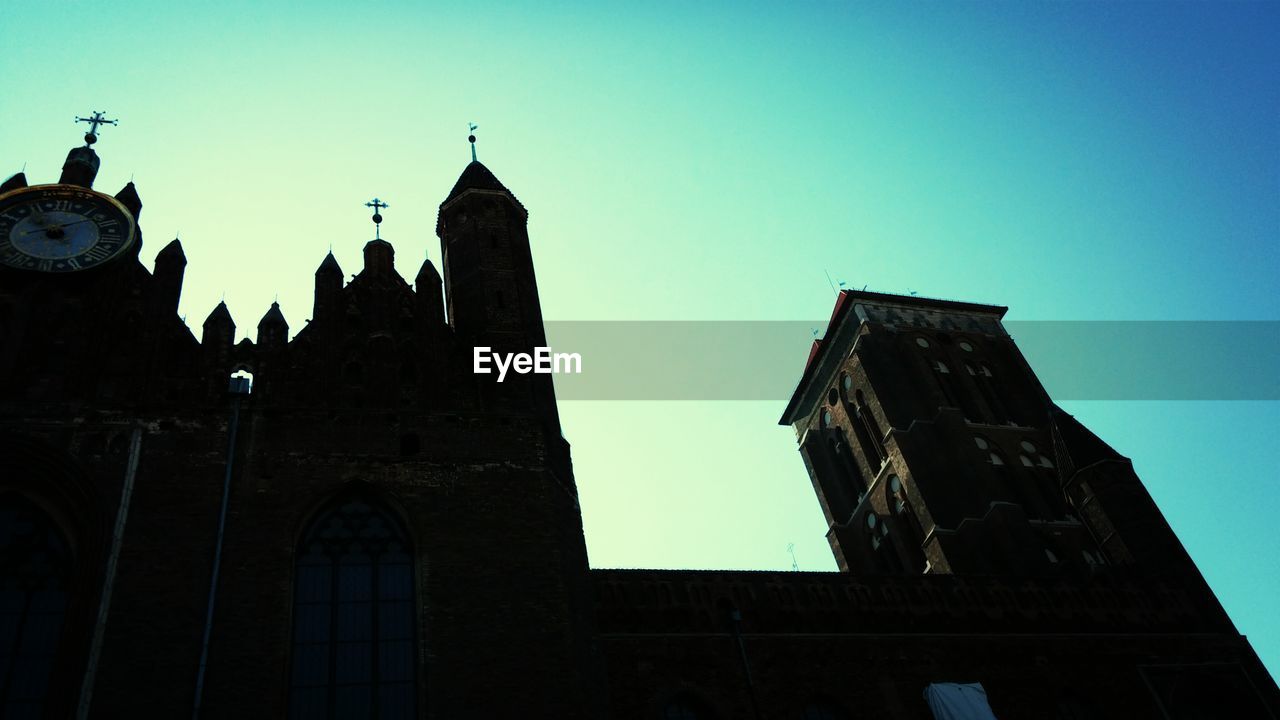 Low angle view of church against clear blue sky