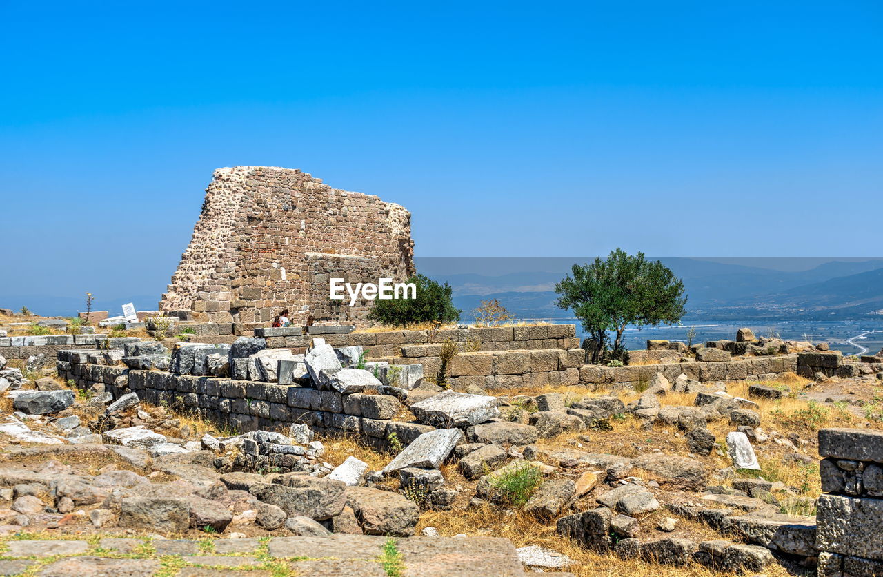 View of old ruin building against blue sky