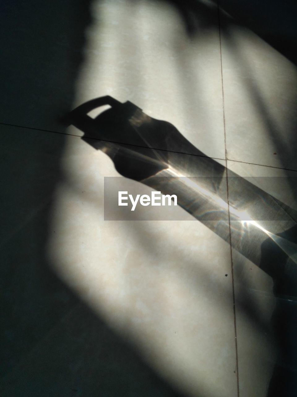 CLOSE UP OF SHADOW ON FLOOR