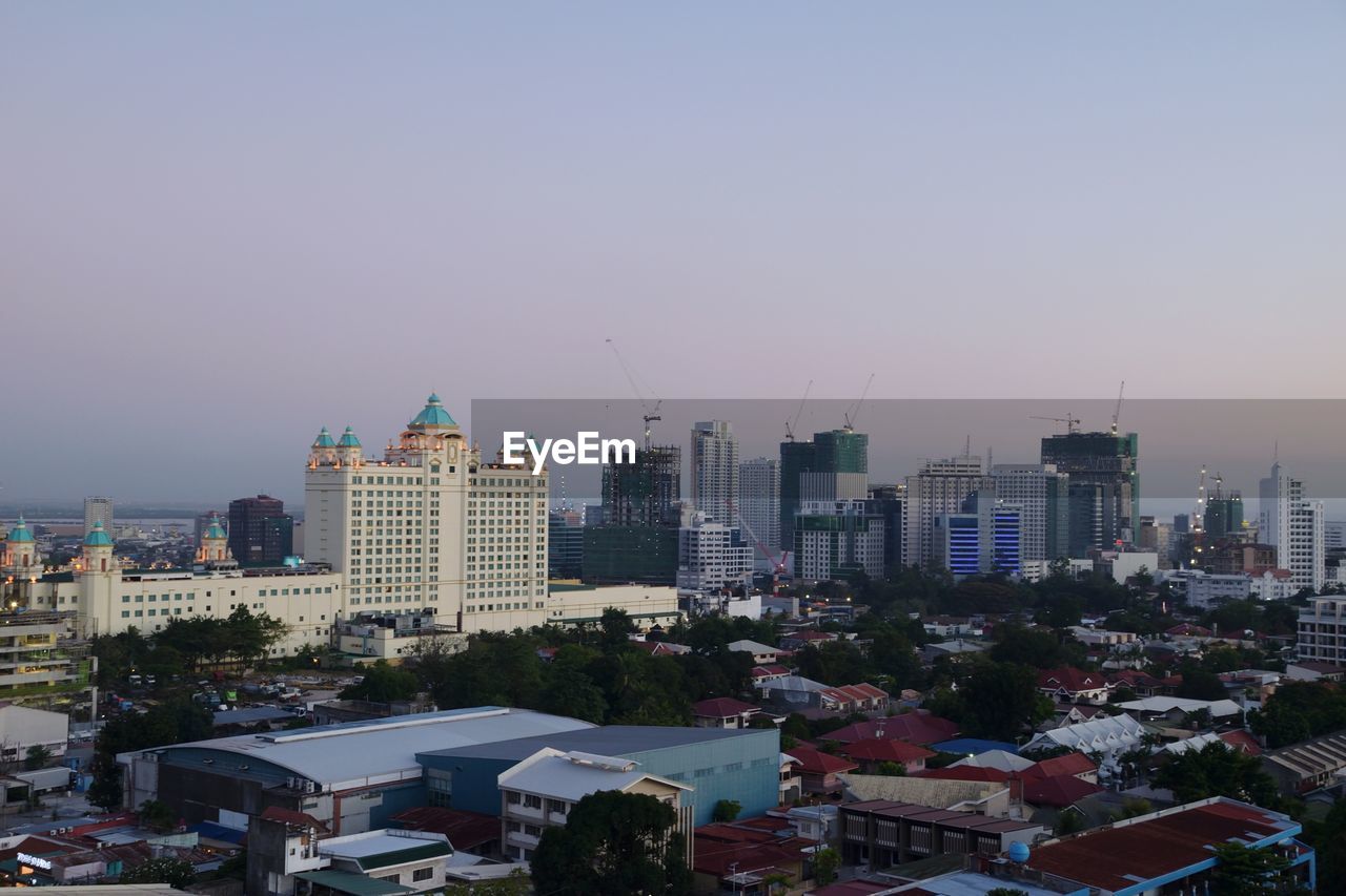 Buildings in city against sky