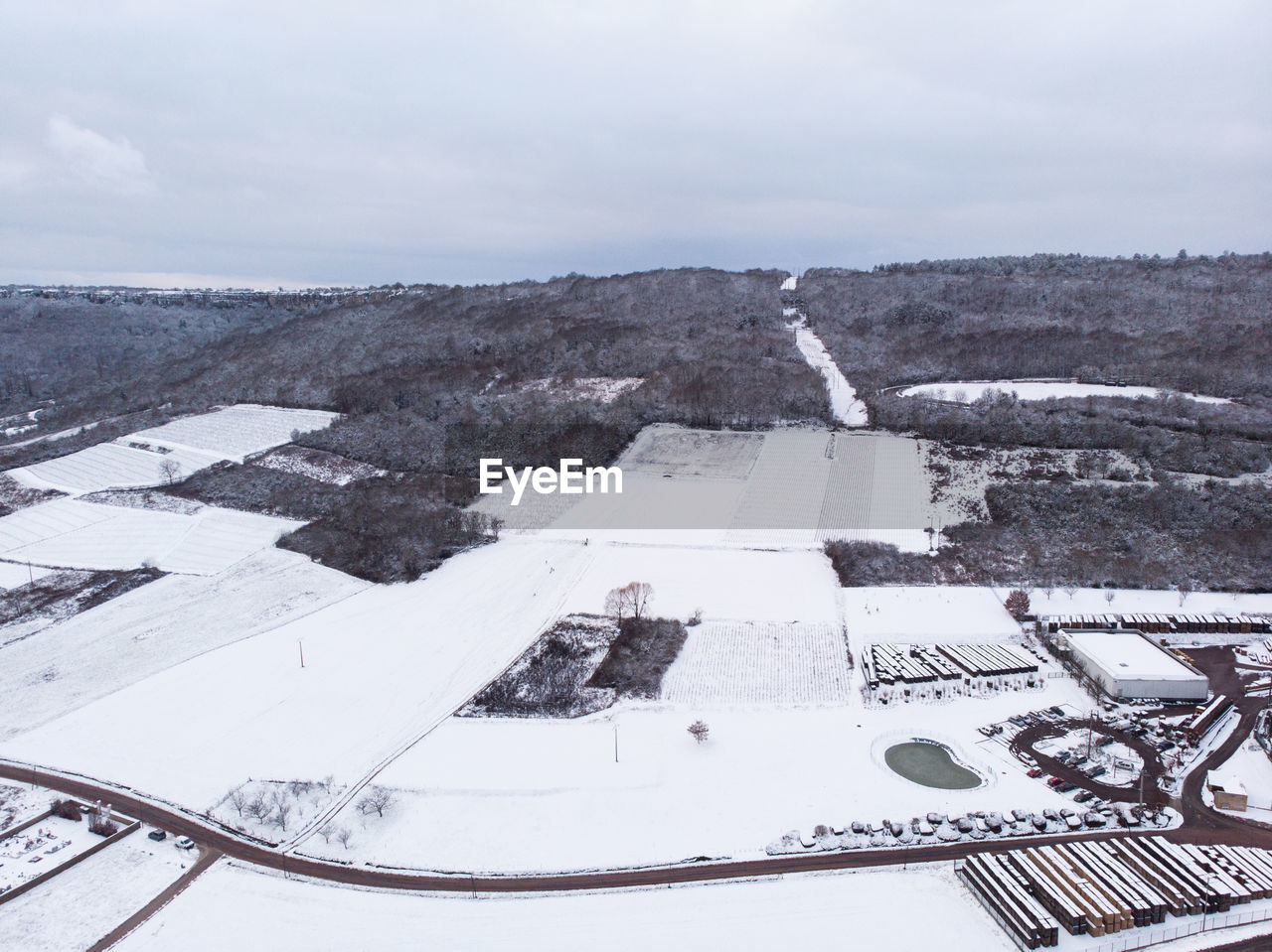 High angle view of snow covered landscape against sky