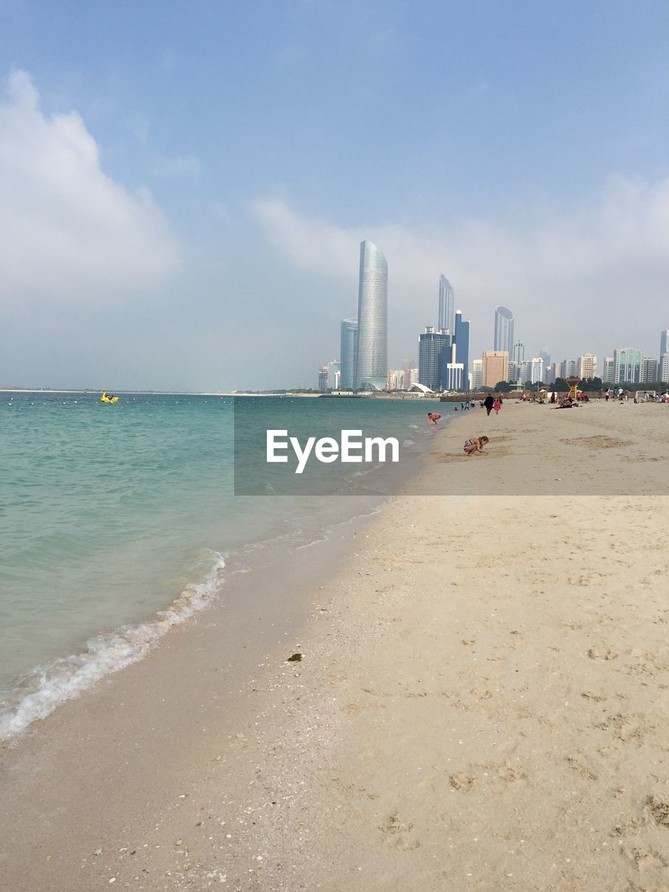 View of beach with city in background