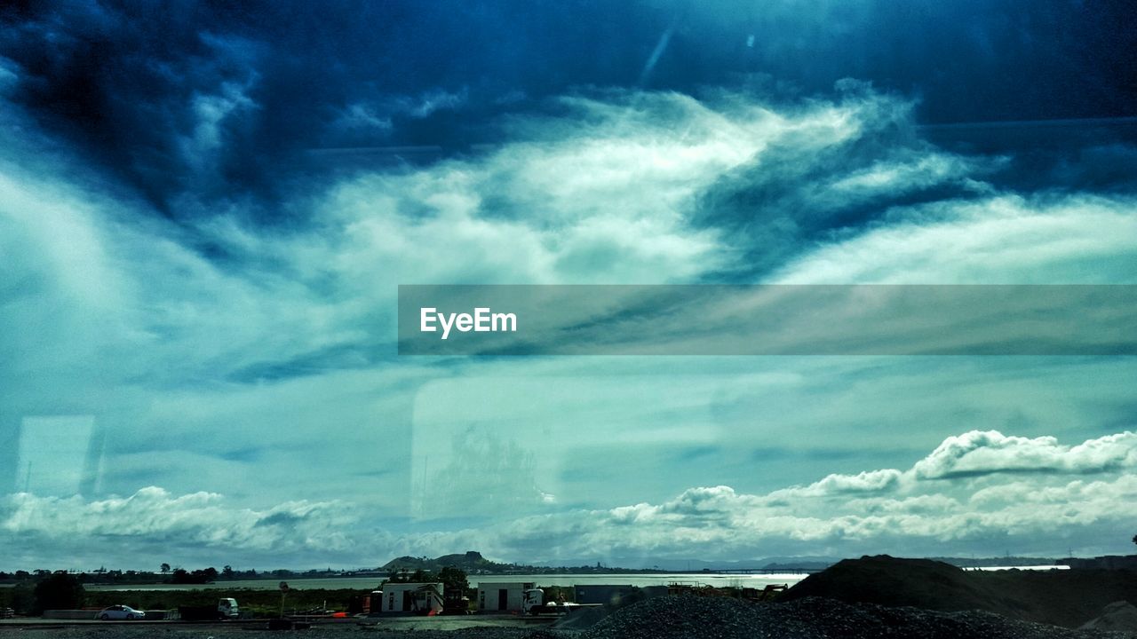 VIEW OF CLOUDY SKY OVER CITY