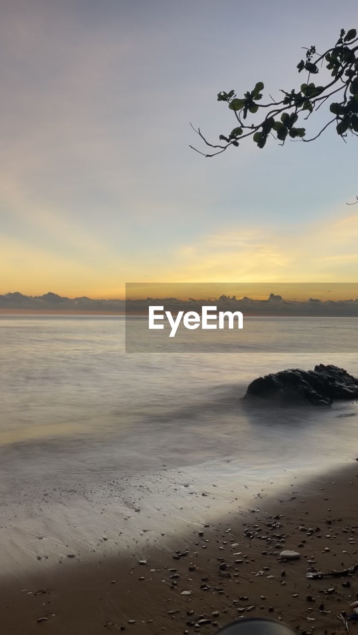 sky, water, sea, land, beach, sunset, beauty in nature, scenics - nature, nature, body of water, shore, tranquility, ocean, cloud, coast, horizon, tranquil scene, horizon over water, sand, environment, wave, dawn, reflection, landscape, no people, outdoors, idyllic, sunlight, seascape, dramatic sky, travel destinations, motion, coastline, wind wave, sun, tree, travel, evening, non-urban scene