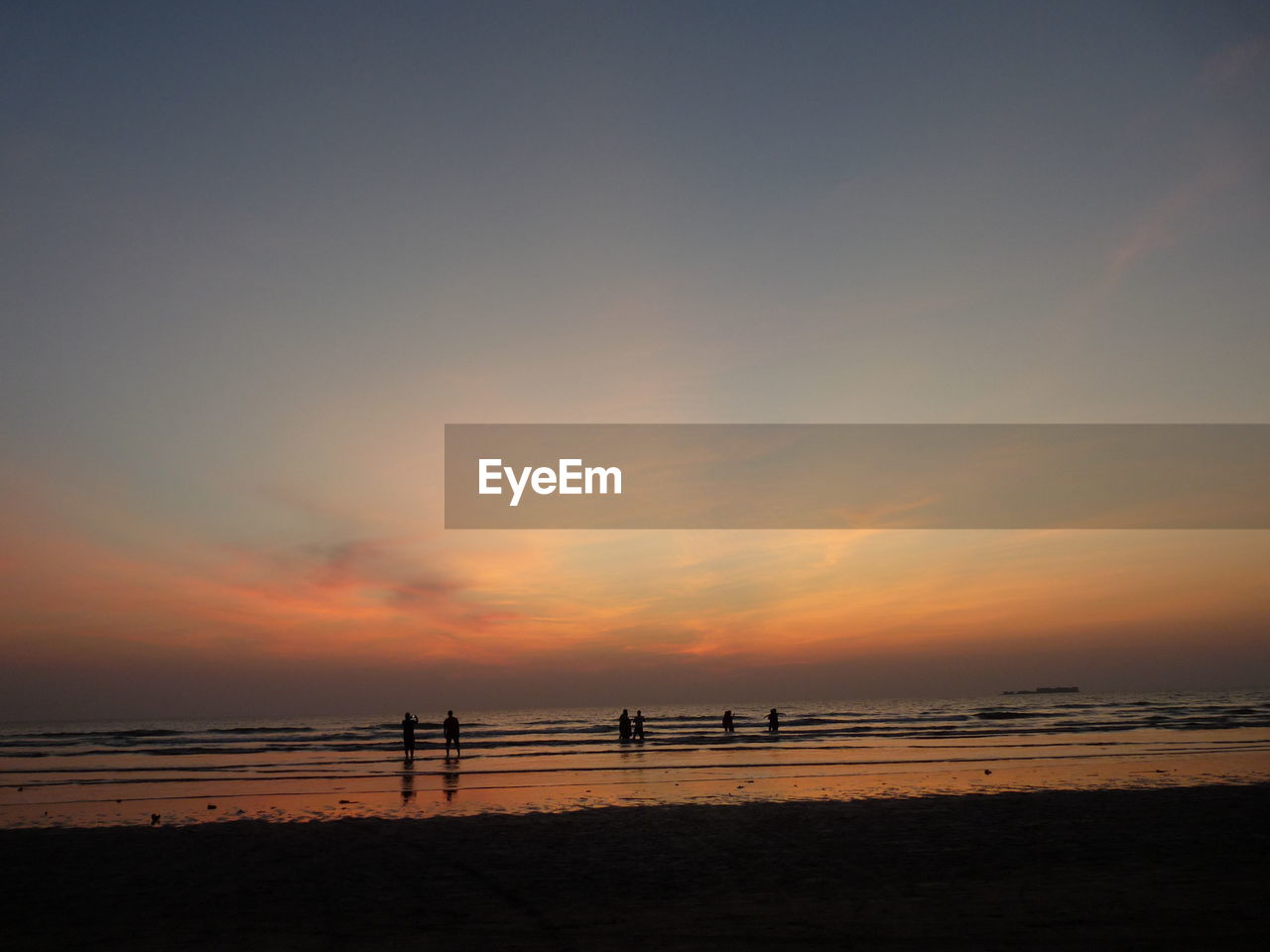 SCENIC VIEW OF BEACH DURING SUNSET