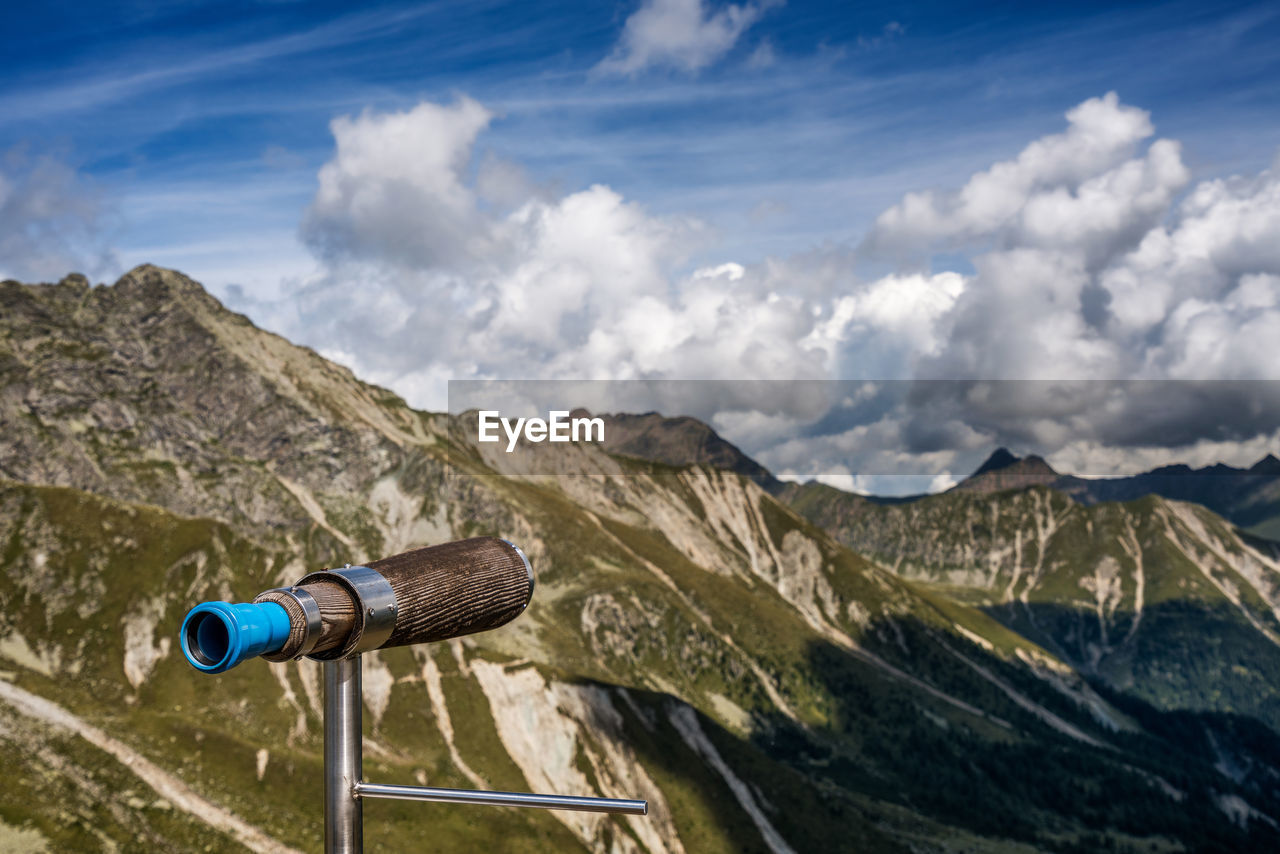 Binoculars against mountains
