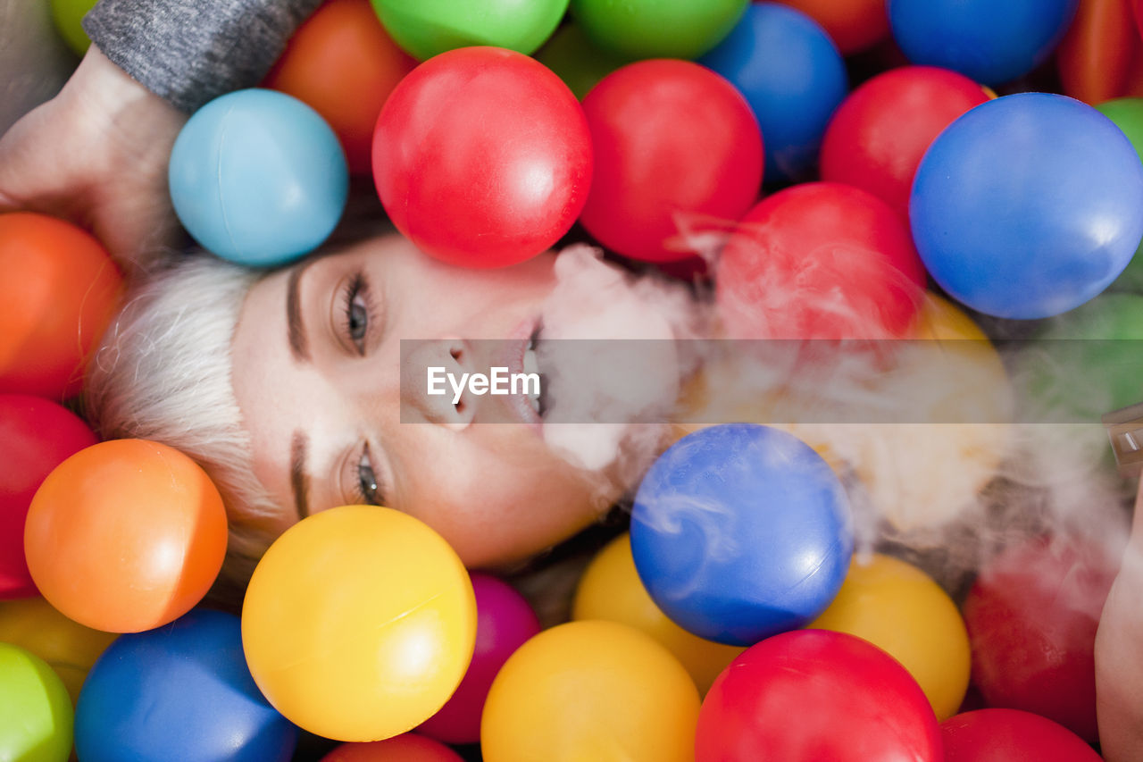 Young woman in a ball pit